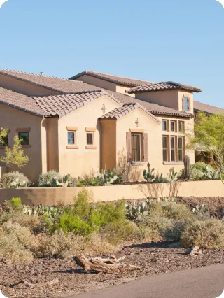 Modern stucco home with desert landscaping representing detailed Orlando pre-listing home inspections.
