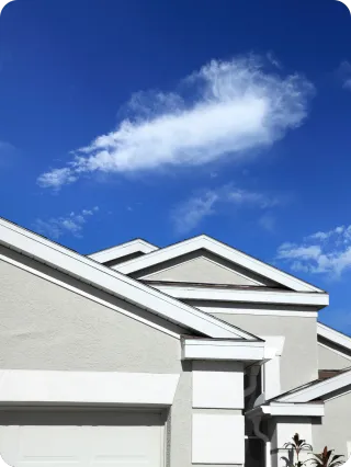 Close-up of modern Orlando home exterior under a bright blue sky, symbolizing pre-listing home inspection benefits.