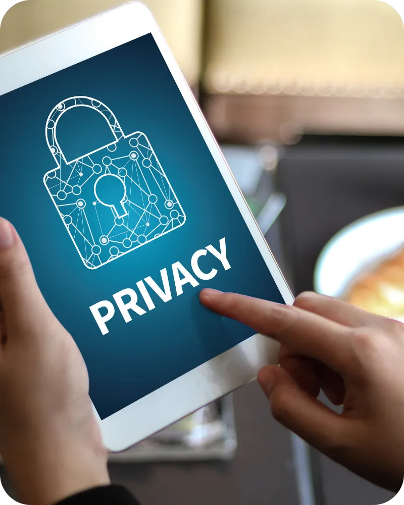 Person holding a tablet displaying a digital lock icon and the word “Privacy,” symbolizing data protection and online security.
