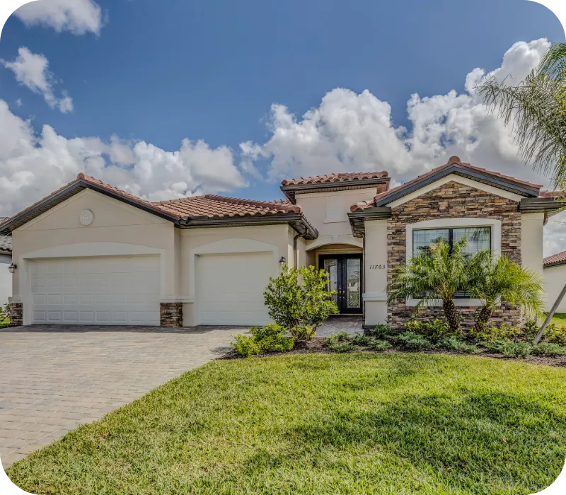 Modern single-story home in Kissimmee, Florida, with manicured lawn and palm trees under a bright sky, representing a well-maintained property ready for inspection.