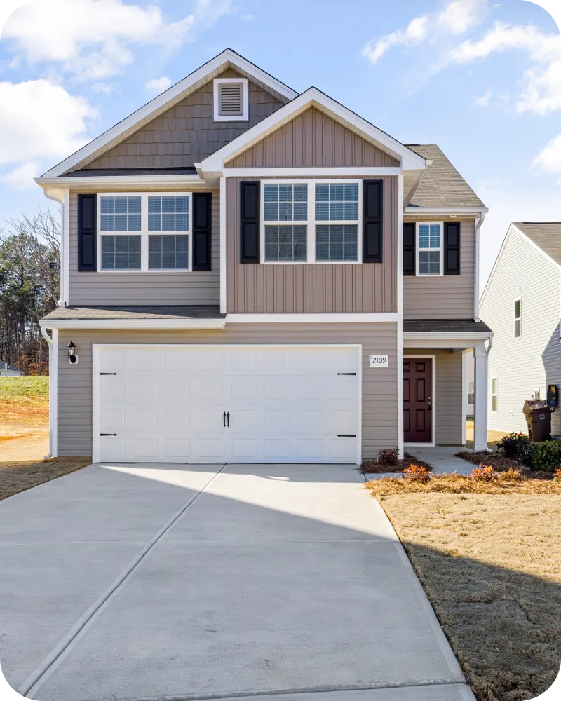 Modern two-story Davenport home with a double garage and clean exterior, representing homes inspected by A.C.F. Home Inspections in Central Florida.