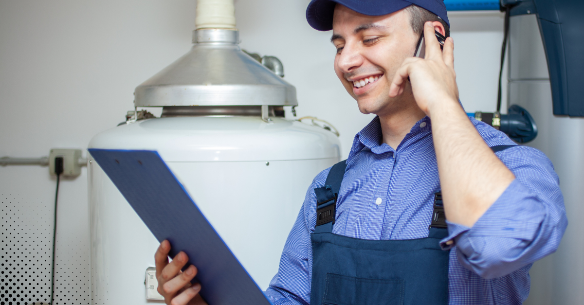 Technician inspecting residential water heater system